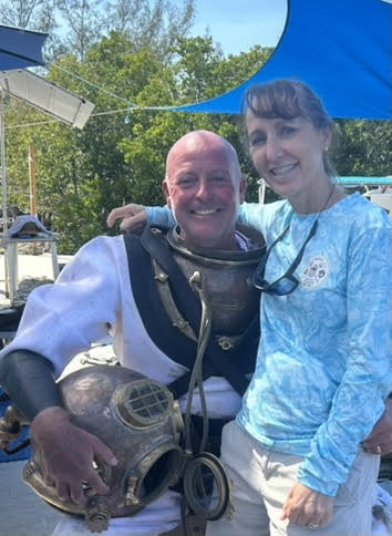 Sharky with julie working at Dive a Mark V